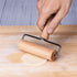 Kitchen rolling pin with integrated flour stick, perfect for smooth dough preparation and preventing sticking.