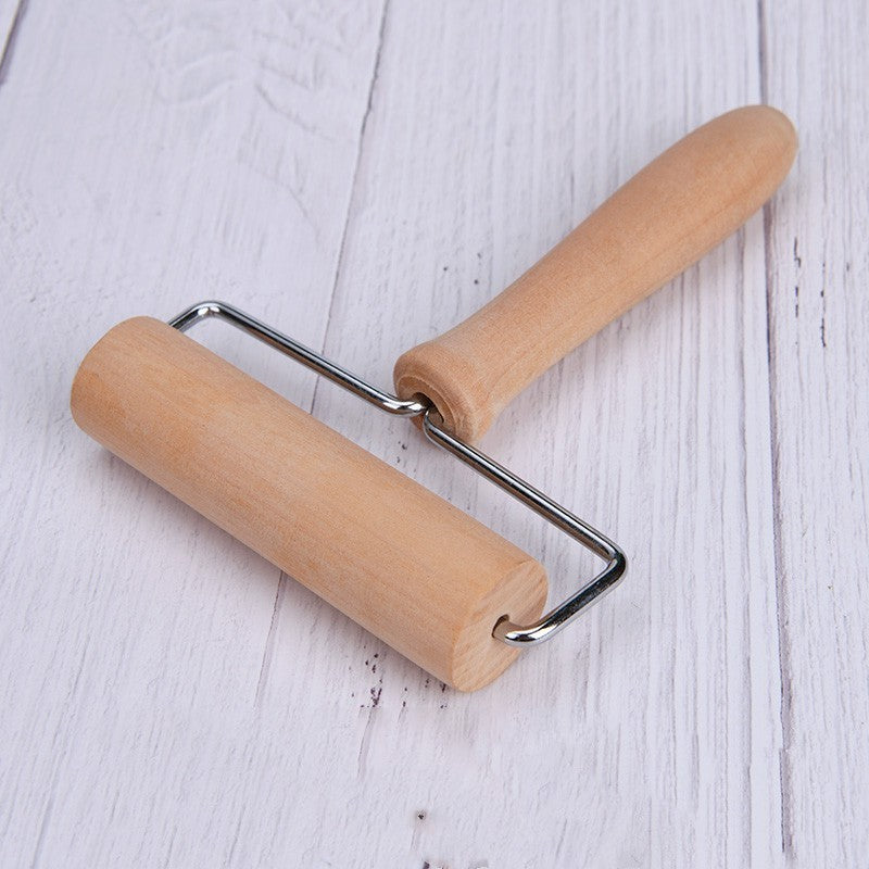 Classic rolling pin, essential kitchen gadget for evenly rolling out dough and flouring surfaces.